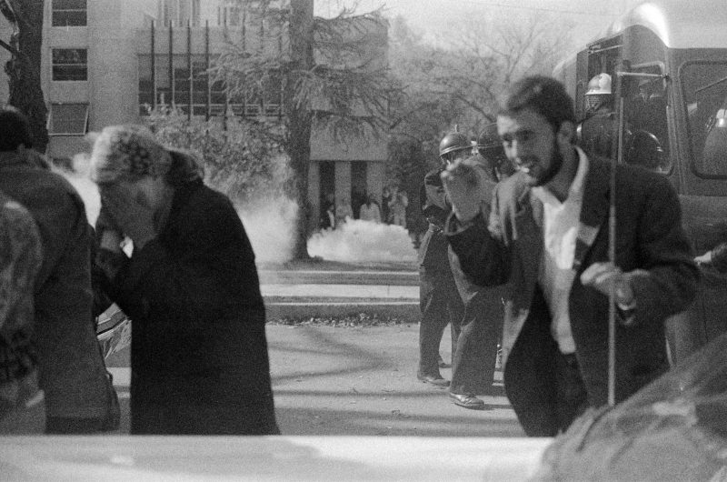 Protesters and bystanders shield their faces and run as tear gas canisters go off around them on the UWÐMadison campus on Oct. 18, 1967.