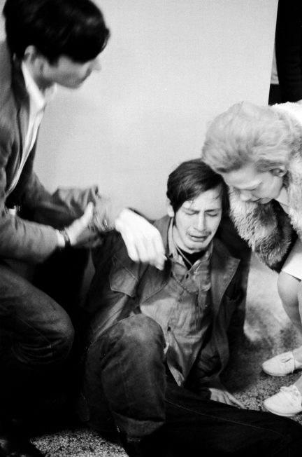 A student in distress is helped by onlookers inside the Commerce Building during the Oct. 18, 1967, protest against Dow on the UW-Madison campus.